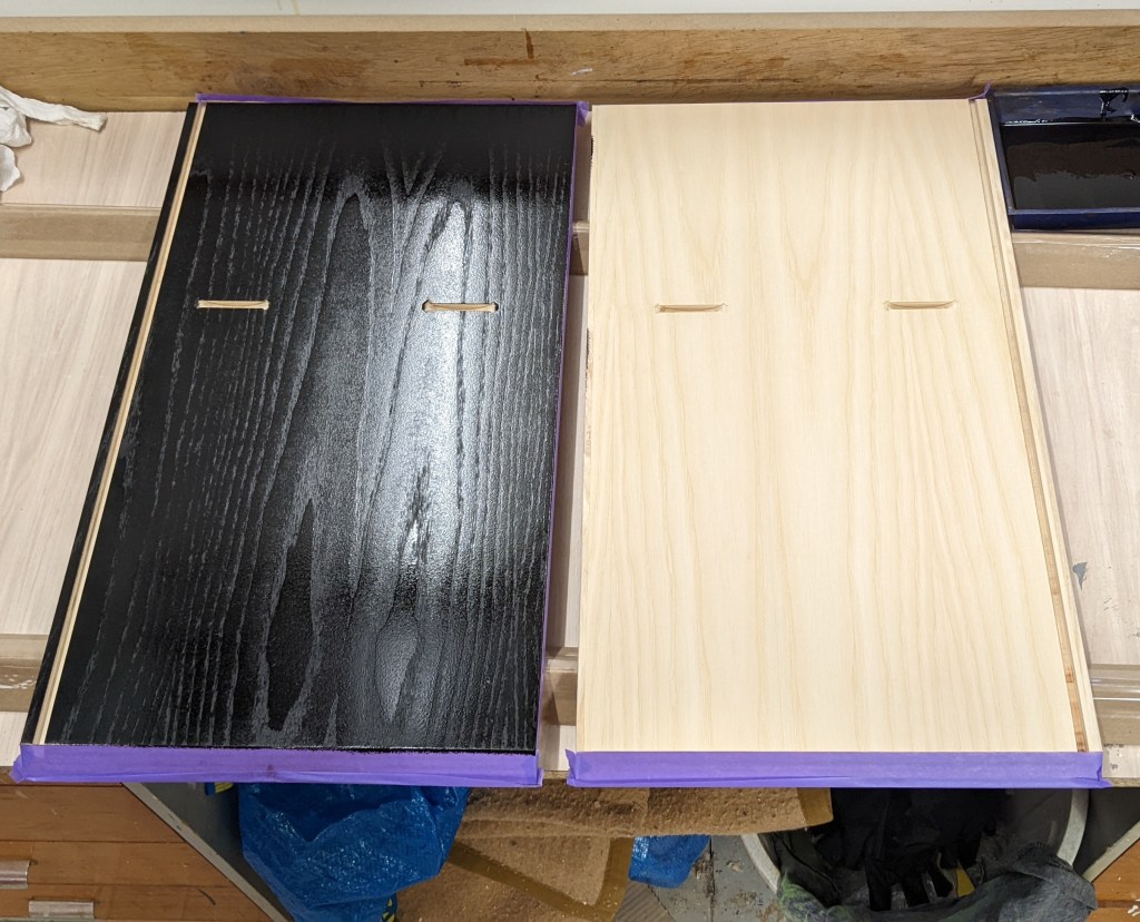 The insides of the cabinets are stained and oiled before gluing them